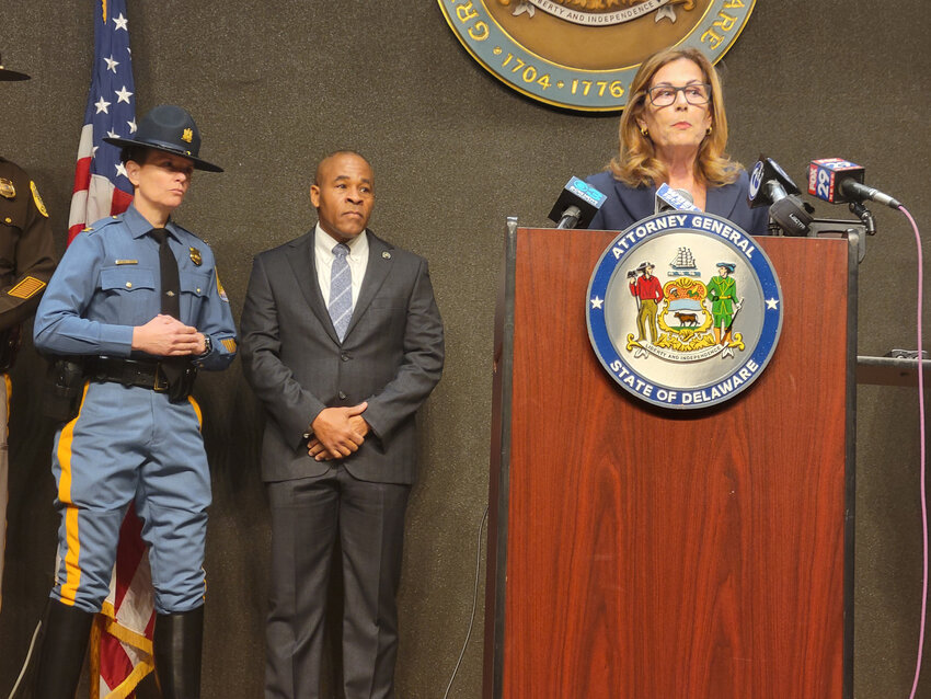 Delaware Attorney General Kathy Jennings speaks at a news conference in Wilmington on Monday, highlighting the drop in the state's violent crime rate. Delaware State Police Superintendent Col. Melissa Zebley and Delaware Department of Safety and Homeland Security Secretary Nathaniel McQueen Jr. listen in.