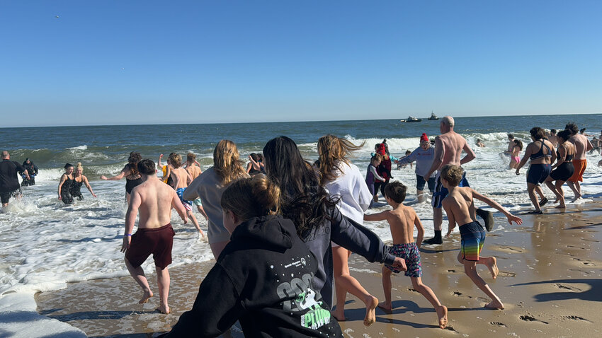 The 33rd Lewes Polar Bear Plunge took place in Rehoboth Beach on Sunday. &quot;Bears&quot; made for the water at exactly 1 p.m.