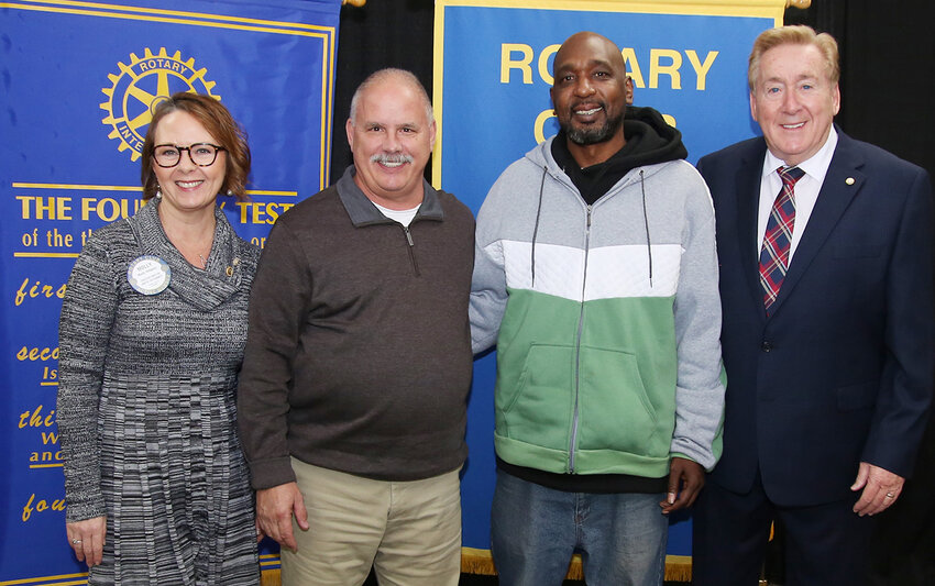 From left, Molly Hilligoss, president of the Rotary Club of Wicomico County, &quot;Hero Award&quot; recipients Bill Suess and Alfred Johns, and ceremony emcee Don Hackett pose after a luncheon Tuesday, Feb. 6, at the Wicomico Civic Center.