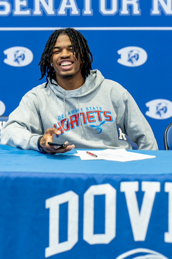 Dover High senior Jakwon Kilby is all smiles on Wednesday after signing with Delaware State, where he plans to participate in both football and track &amp; field. Photo courtesy Joseph Solomon.