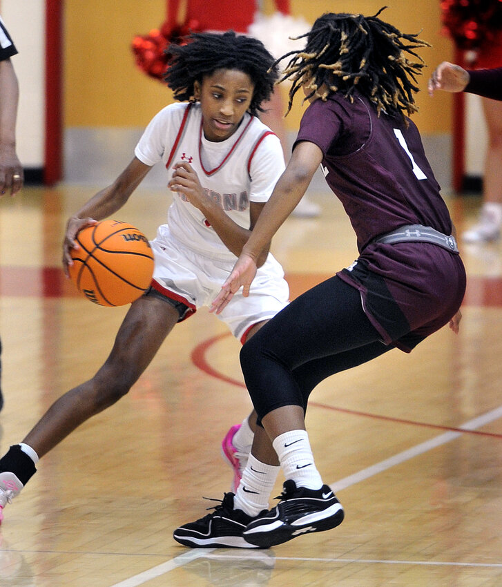 Sophomore point guard Amiyah Ellerbe of Smyrna trying to bring the ball up court past Chasity Wilson of Caravel.  The Buccaneers won the contest, 72-57. SPECIAL TO THE DAILY STATE NEWS/GARY EMEIGH