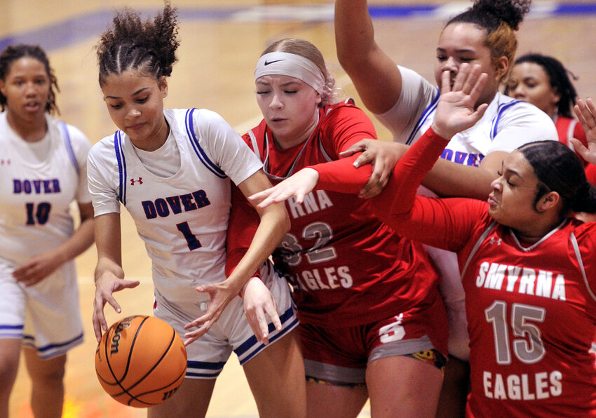 Malya Milstead of Dover trying to recover a loose ball ahead of Smyrna&rsquo;s Skylar Curley.  SPECIAL TO THE DAILY STATE NEWS/GARY EMEIGH