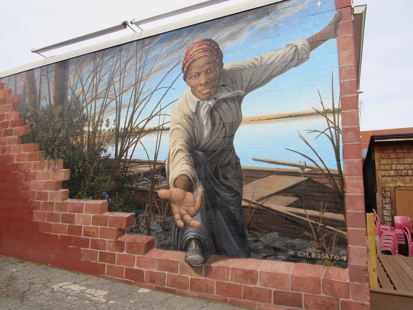 The &quot;Take My Hand&quot; mural, created by Michael Rosato, embraces the legacy of Harriet Tubman and her willingness to help individuals find freedom.