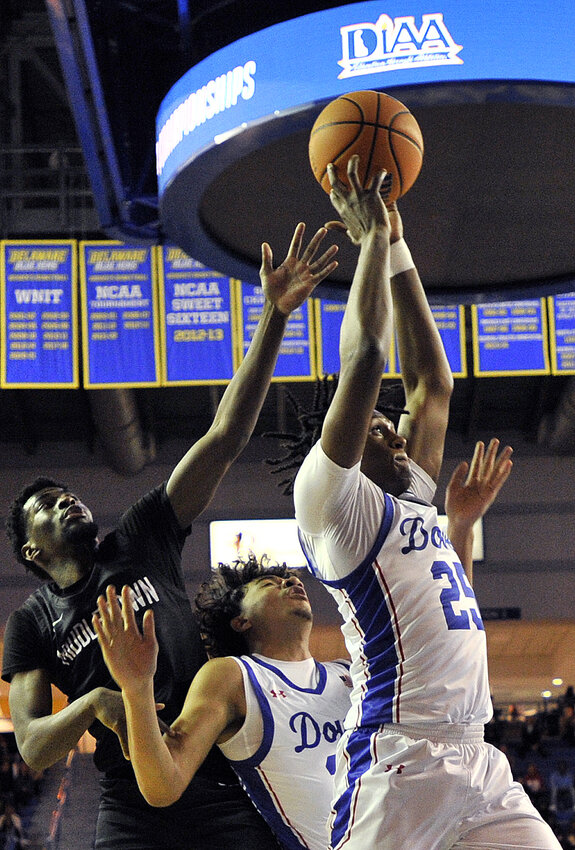 Istavan Norwood of Dover pulls down a rebound in Thursday night&rsquo;s DIAA state semi-final game against Middletown.  SPECIAL TO THE DAILY STATE NEWS/GARY EMEIGH