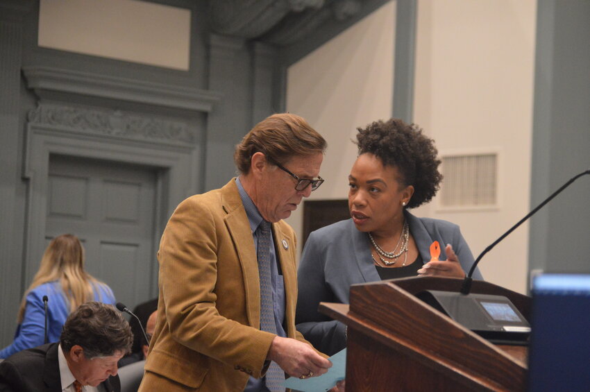 House Minority Leader Mike Ramone, R-Newark, and House Majority Leader Melissa Minor-Brown, D-New Castle, have a discussion on the floor during Thursday's session.
