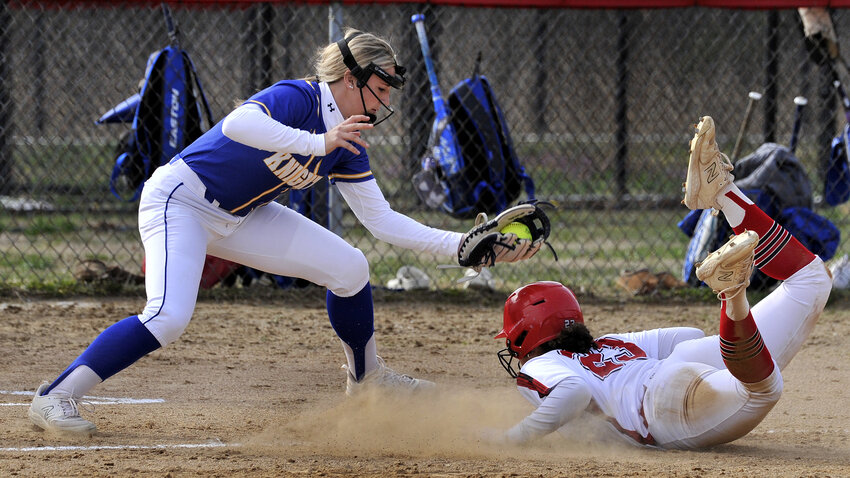 Polytech's Kyla Davis advanced to third after she stole second base and the low throw got past the Sussex Central shortstop. Sussex Central freshman Lauren Myers puts on a late tag. SPECIAL TO THE DAILY STATE NEWS/GARY EMEIGH