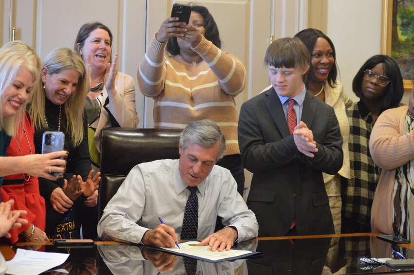 Gov. John Carney was surrounded by lawmakers and advocates as he signed a proclamation recognizing World Down Syndrome Day in the First State.