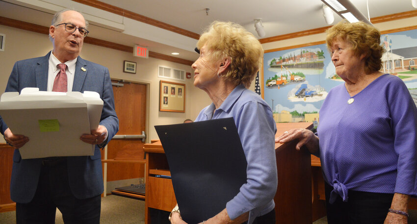 State Rep. Danny Short, a former Seaford mayor, presents tributes from the Delaware House of Representatives to Sara Lee Thomas, left, and Sue Wile, who are both retiring after 30-plus years of service with the Downtown Seaford Association.