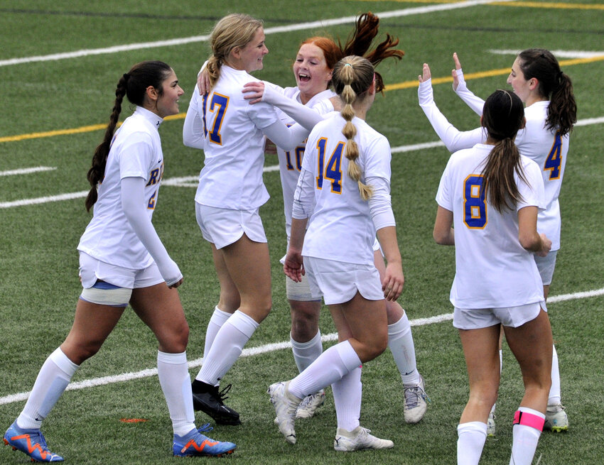 Caesar Rodney freshman Anna Hake (17) is congratulated by her Rider teammates after she scored a goal to make the score 2-0 over Lake Forest in the first half.  SPECIAL TO THE DAILY STATE NEWS/GARY EMEIGH