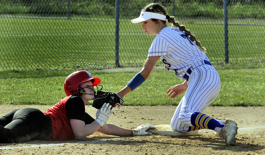 Gabrielle Bogdon of Polytech dives back to third base just ahead of tag by CR&rsquo;s Kaitlyn Krass on a pickoff attempt in the first inning. SPECIAL TO THE DAILY STATE NEWS/GARY EMEIGH