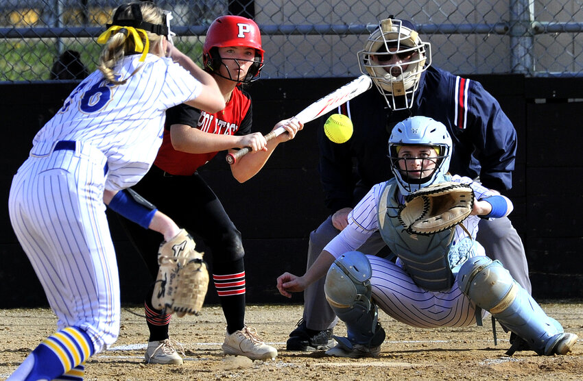 Kylie VanHorn of Polytech looks to bunt a pitch from CR&rsquo;s Montana Fox to catcher Madison Fox.  SPECIAL TO THE DAILY STATE NEWS/GARY EMEIGH
