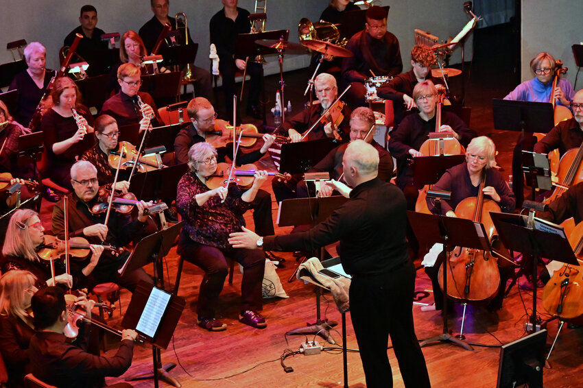 SODELO music director James Allen Anderson conducts the orchestra on stage at the Grand Opera House in Wilmington during a Nov. 29 concert.