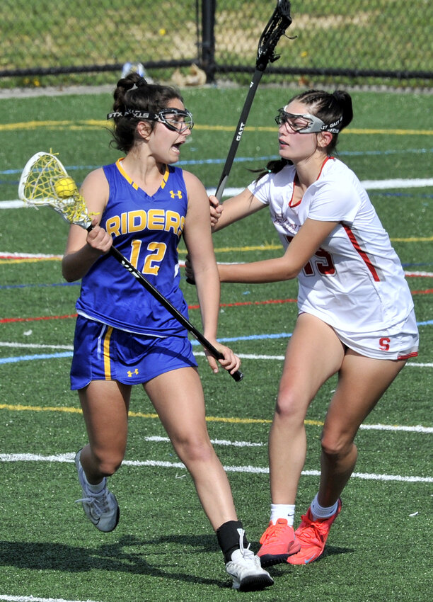 Caesar Rodney freshman Brooke Roberts looks to pass with Grace Smeltzer trying to block. SPECIAL TO THE DAILY STATE NEWS/GARY EMEIGH
