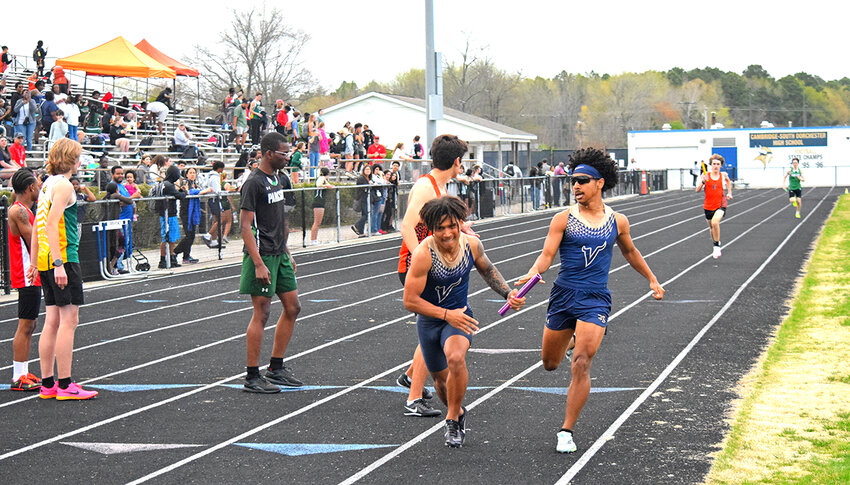 Tekai Drummond, at right, passed the baton to his brother Teshar during the 4x400-meter relay race on April 10. The two Vikings, with teammates Zy'Meir Wilson and Tori Willis Jr. won the event.