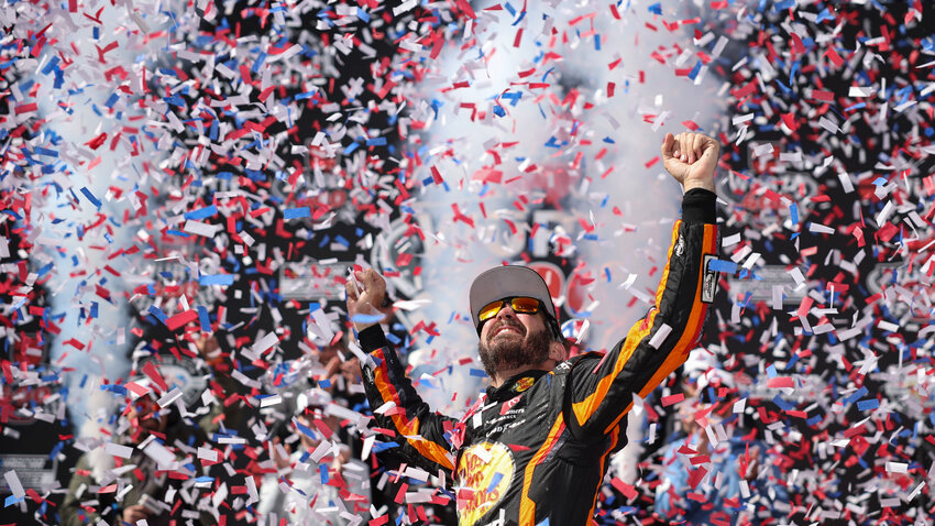 Martin Truex Jr., driver of the No. 19 Bass Pro Shops Toyota, celebrates in victory lane after winning the NASCAR Cup Series W&uuml;rth 400 at Dover International Speedway on May 1, 2023.