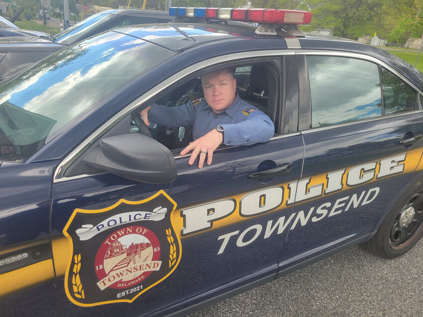 Sgt. Earl McCloskey sits in a patrol car outside the Townsend Police Department on Wednesday.