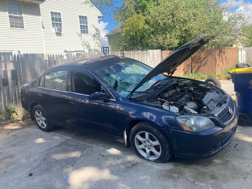 This vehicle has been abandoned in a Dover neighborhood since before March, and since its&rsquo; windshield has been shattered, parts of the car stolen, and one side of it sits up on a jack.