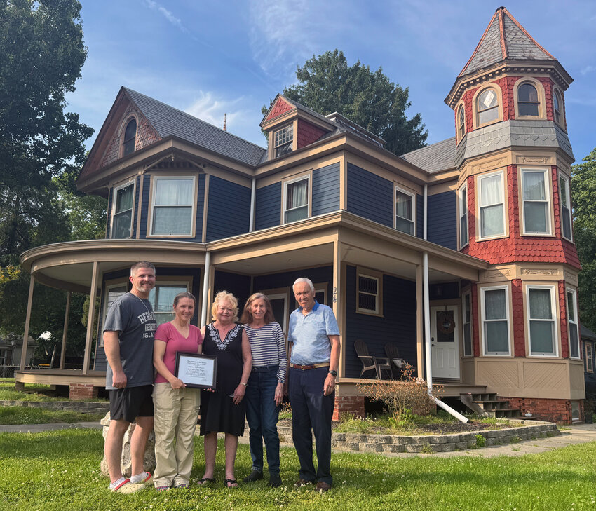 From left, Jacob Ferger, Jackie Ferger, Helene Altevogt, Mary Mason and Tom Smith with the recognition the Fergers received from The Friends of Old Dover for their restoration of Magnolia's Lindale house.