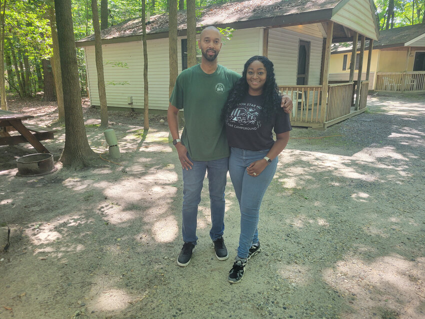 G&amp;R Campground owners Leonard and Yolanda Young stand among its cabins.