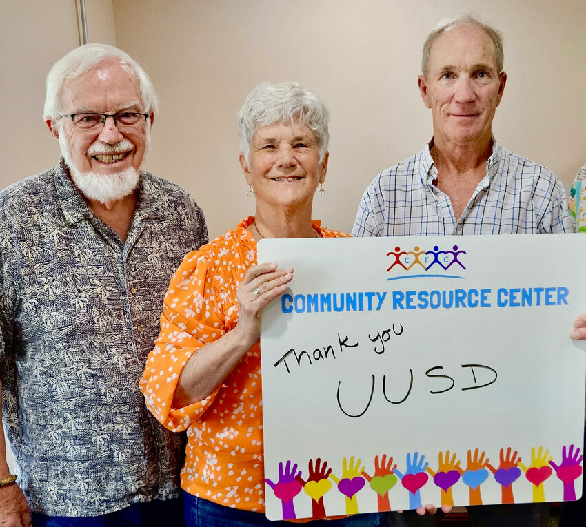 From left, Mac Goekler and Jan Daily of the Unitarian Universalists of Southern Delaware join Dave Galdun, a Community Resource Center support service specialist.