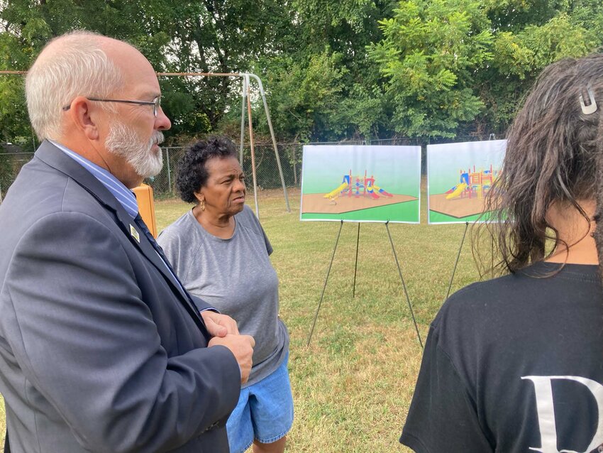 Kent County Levy Court Commissioner George &quot;Jody&quot; Sweeney discusses playground renovations coming to Capitol Park with longtime resident Mary Ann Wiltbank on Friday. DAILY STATE NEWS/MIKE FINNEY