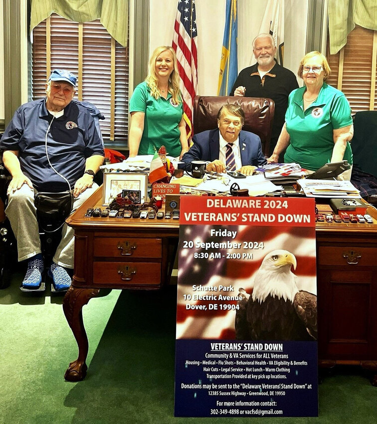 From left, Bill Jiron, Mindy Bacchus, Dave Skocik and Liz Byers-Jiron surround Dover Mayor Robin Christiansen in his office in April during the kickoff of the 2024 Veterans Stand Down, coming to Dover&rsquo;s Schutte Park on Friday. DAILY STATE NEWS FILE PHOTO