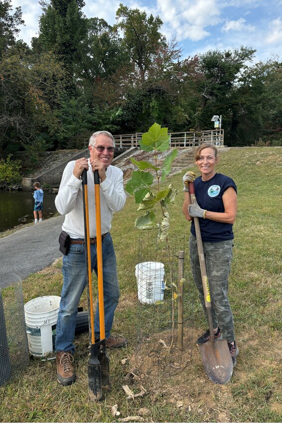 Dover-area resident Eric Crossan (left) and Edna Stetzar, of the Delaware Division of Natural Resources and Environmental Control's Division of Fish and Wildlife, planted some trees at Moore's Lake Park to replace some that were lost in the August 2020 tornado that struck Dover. PHOTO COURTESY OF ERIC CROSSAN