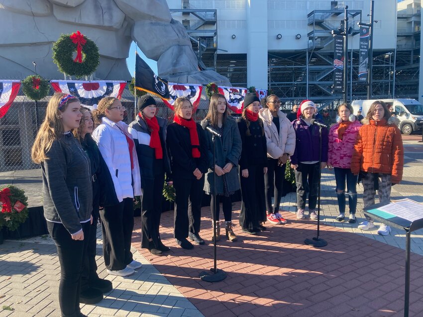 Members of the Dover Air Force Base Middle School Chorus got Thursday&rsquo;s Wreaths Across America ceremony started at Dover Motor Speedway with a medley of patriotic and Christmas tunes. DAILY STATE NEWS/MIKE FINNEY