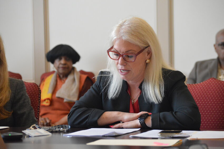 Sen. Nicole Poore reads in House Bill 65 on May 14, which would move the state's primary election to April, as lead sponsor Rep. Stephanie T. Bolden watches on.