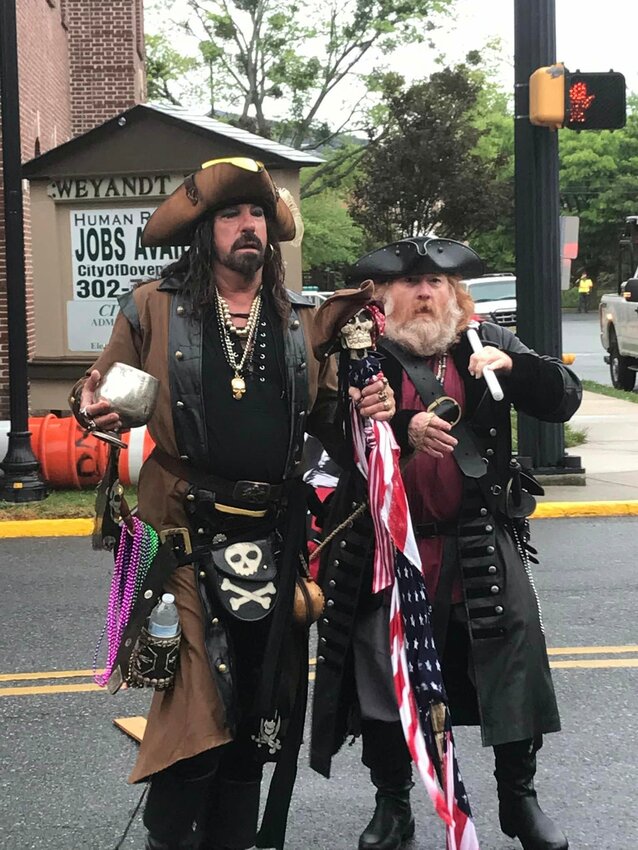 A couple of pirates walk in the Dover Days parade in 2024 to promote the annual Buccaneer Bash held at Bowers Beach every year. PHOTO COURTESY OF THE BOWERS BEACH MARITIME MUSEUM