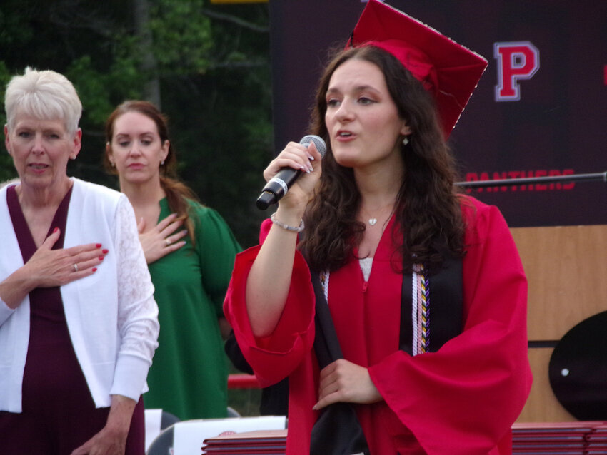 Evelyn Kopp performs the National Anthem at Polytech's graduation on June 5.