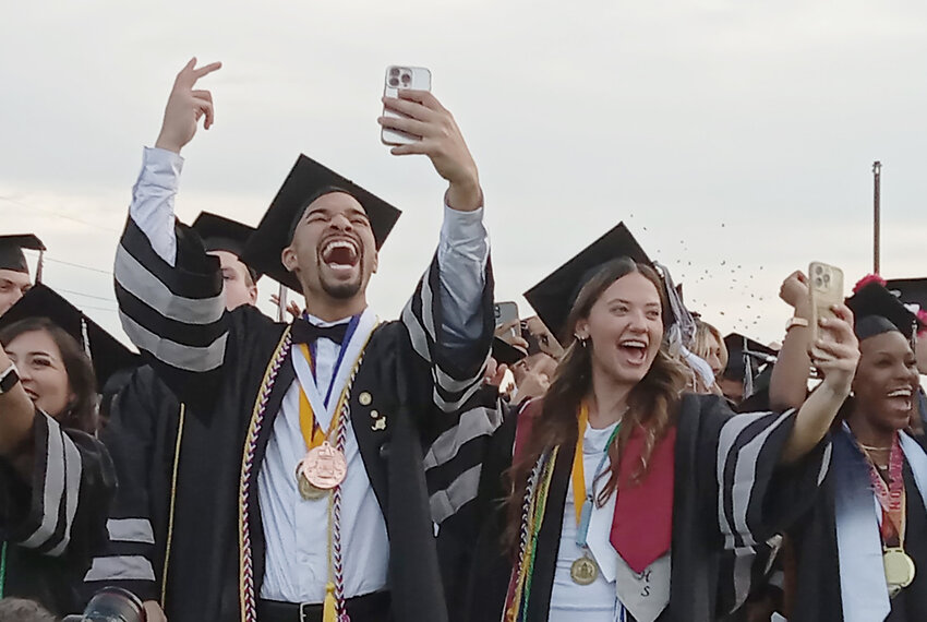 Sussex Tech Class of 2026 salutatorian Adiel Gonzales and valedictorian Haley Pickinpaugh celebrate at the conclusion of the commencement ceremony.