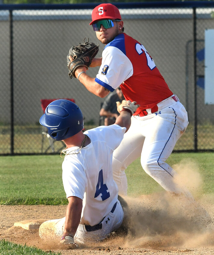 Post 14 second baseman Chase Hortiz trying for a double play after forcing out Dover&rsquo;s Kole Turner (4). SPECIAL TO THE DAILY STATE NEWS/Gary Emeigh