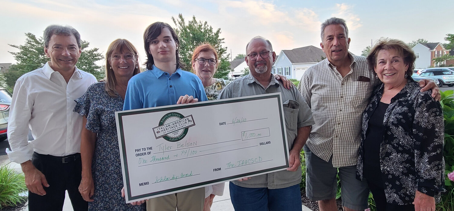 From left, Dr. Art Belson, Michele Belson, Tyler James Belson, Lynn Lombardo-Stanley, Lou Pastore, James Palmieri and Tina Donofrio took part in a check presentation to Tyler from the Italian-American Heritage Club of Sussex County.