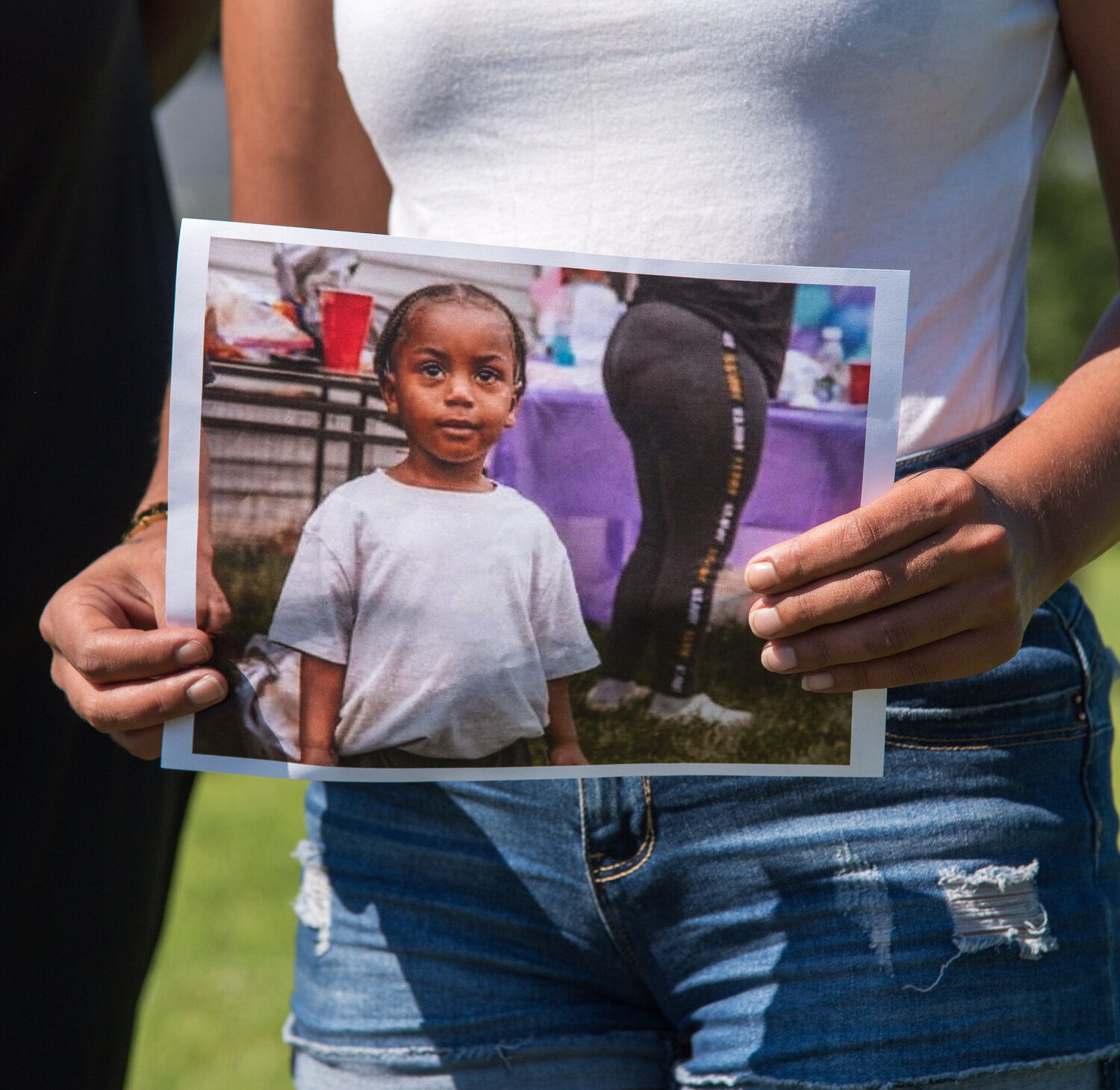 Clerra Hurley holds a photo of Kasai Bull outside Delaware State Police Troop 3 in Camden on Wednesday. Delaware State Police said a driver struck and fatally injured 3-year-old Kasai last week and left the scene of the collision. The incident is still under investigation.