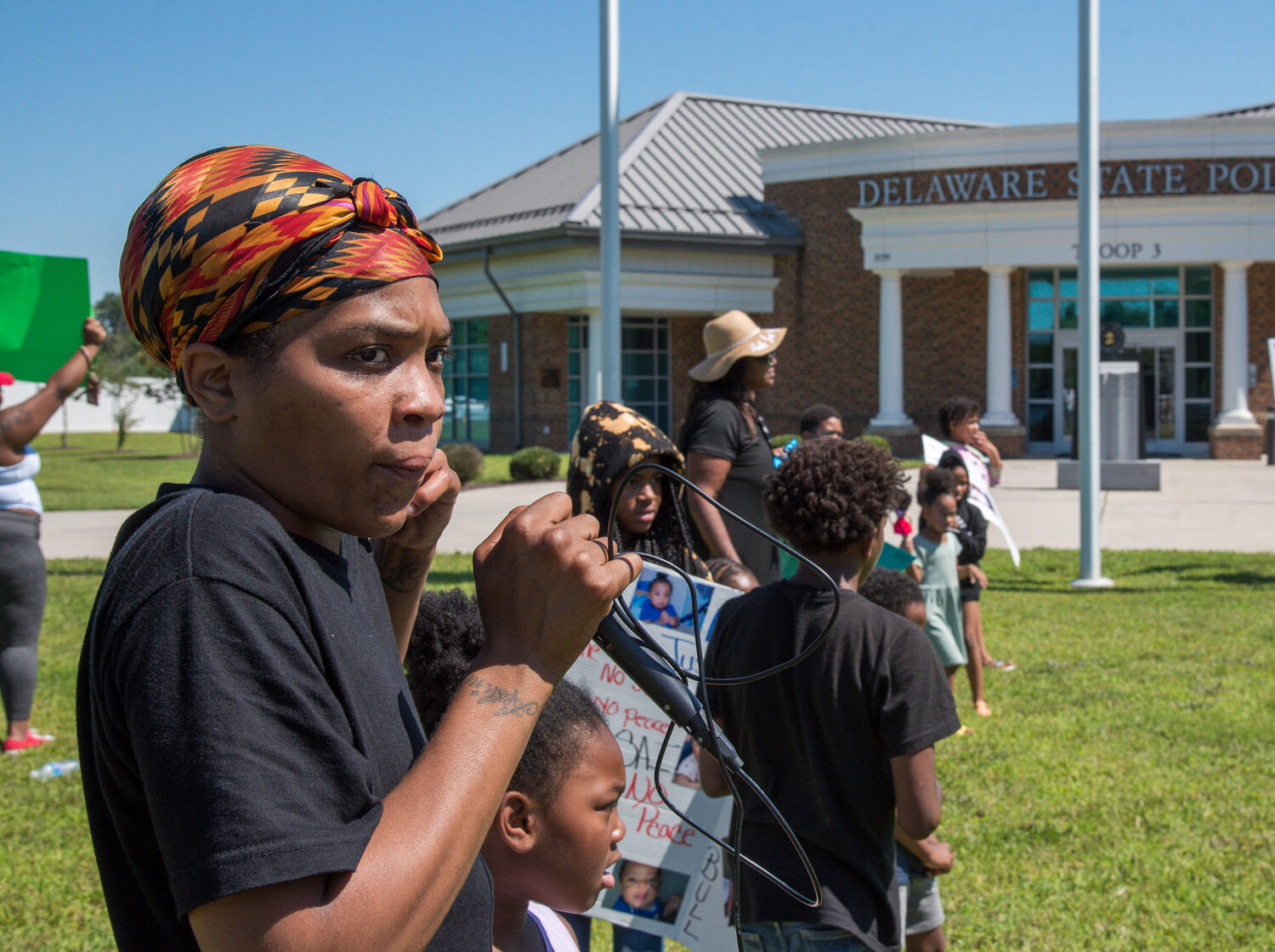 Nautica Saunders, an aunt of Kasai, protests with friends and family outside Delaware State Police Troop 3 in Camden on Wednesday. The demontrators said they were there for justice due to what they claim was driver negligence. Family and friends are calling for an arrest; Delaware State Police say they are continuing to investigate the incident.