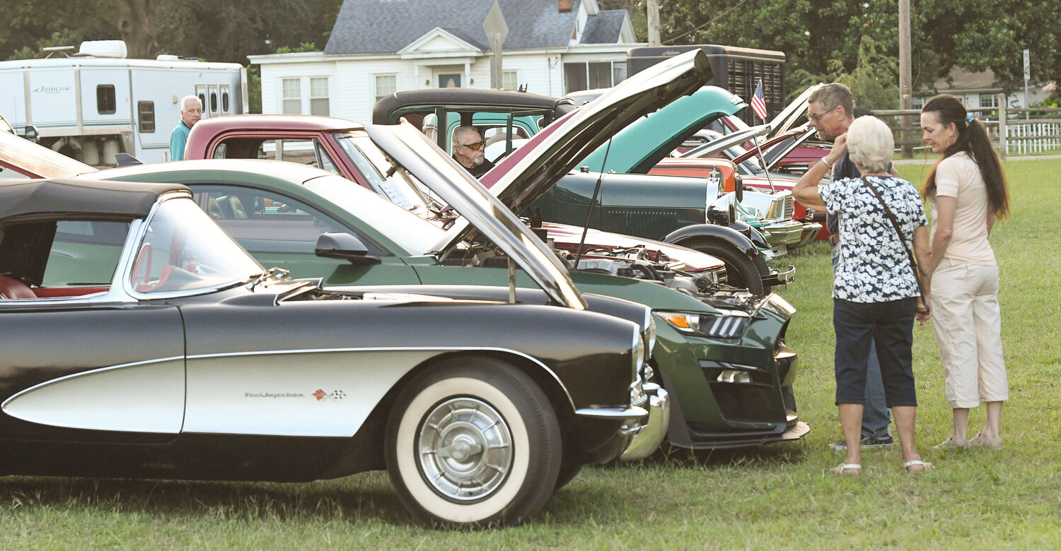 Spectators look at classic cars during the annual Wicomico County Fair.