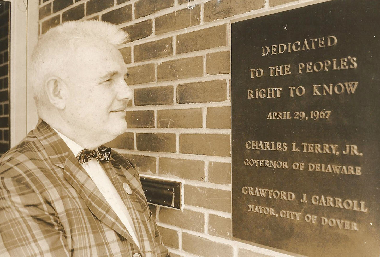 Jack Smyth published the first edition of the Delaware State News in 1953. Shown here, he celebrated the opening of a new Dover office and offset printing plan in 1967.
