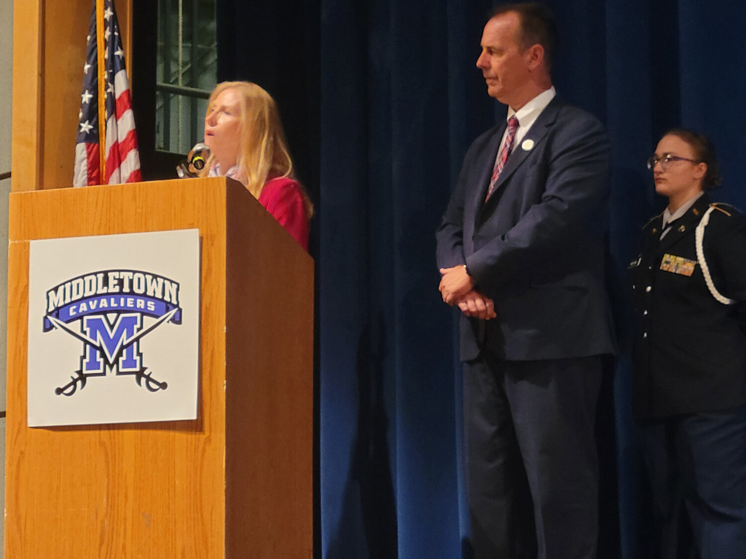 State Sen. Stephanie Hansen, left, speaks at the Patriot Day Ceremony held in remembrance of 9/11 Monday at Middletown High, joined by Rep. Kevin Hensley. The legislators were primary sponsors of the 9/11 Remembrance Flag Act that became law in 2022.