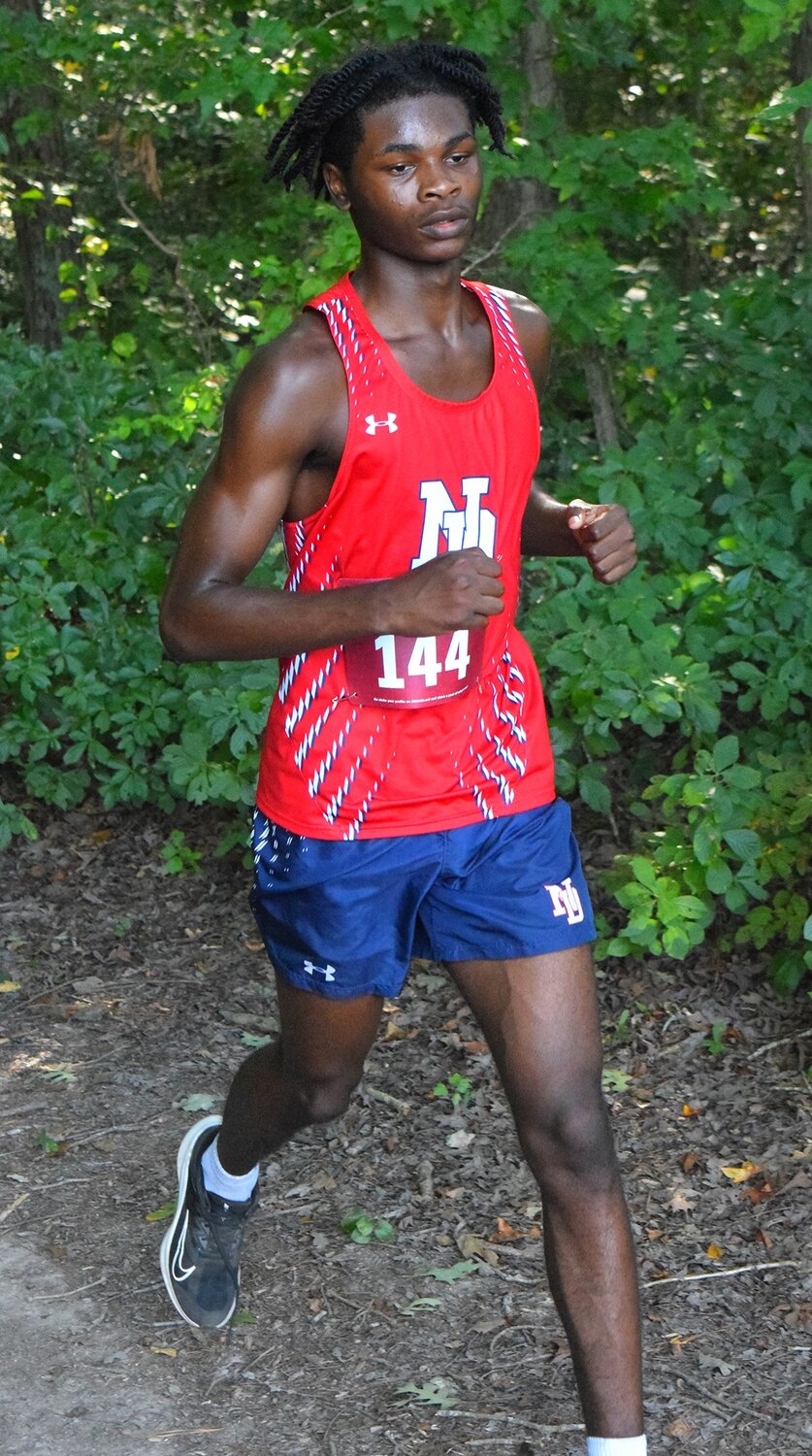 North Dorchester's Tyree Dotson emerged from the forest trail.
