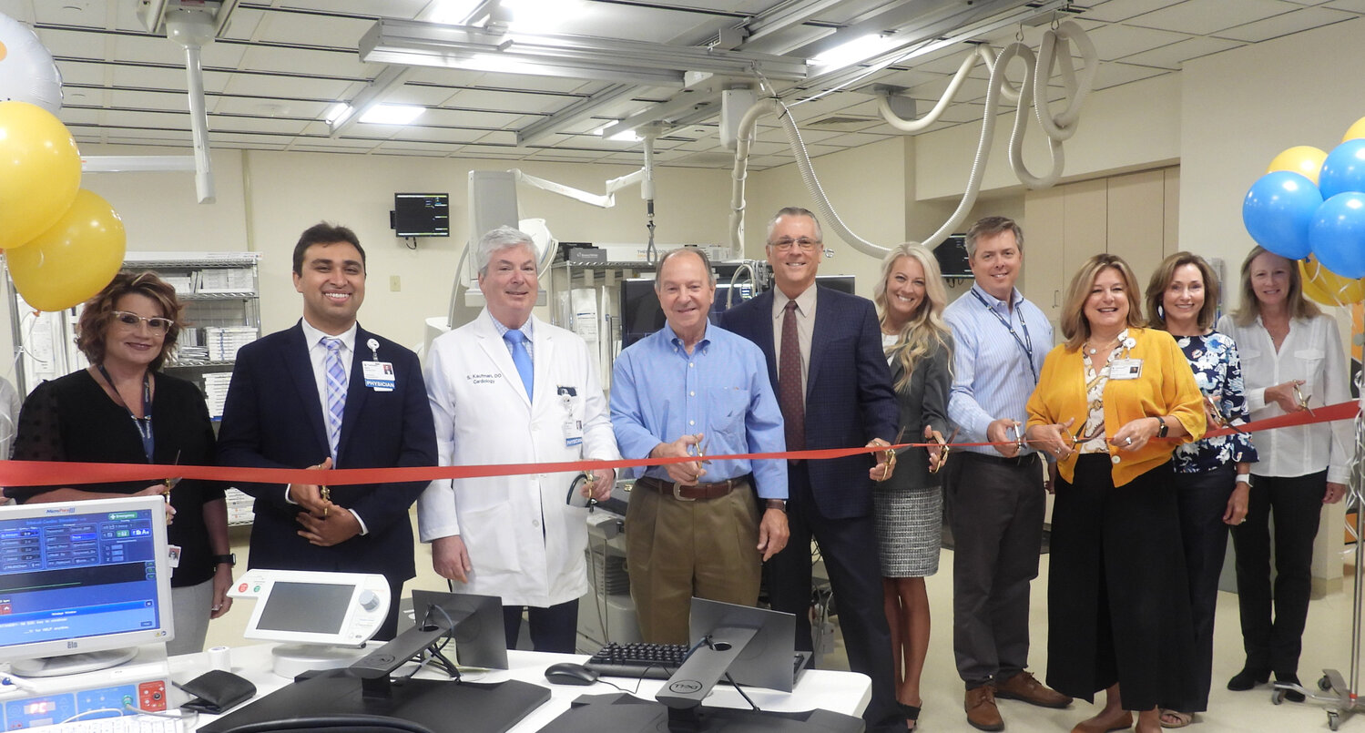 Attending the Electrophysiology Lab ribbon cutting are, from left, Lisa Gullett, Cath Lab supervisor; Dr. Akhil Parashar; Dr. Scott Kaufman; Chick Allen; Dr. Richard Simons; Jessica Hales, TidalHealth Foundation president; Dr. Steve Leonard, president/CEO of TidalHealth; Penny Short, TidalHealth Nanticoke president; and Maria Lehman and Tammy Paxton, both members of the TidalHealth Nanticoke board of directors. Not pictured is Barbara Allen.
