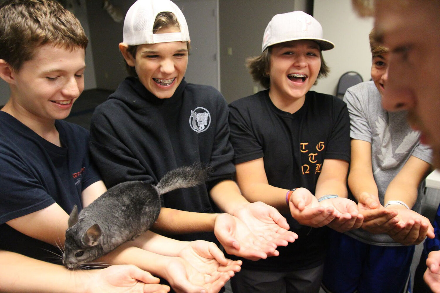 Caleb Gritton, Josh LoRusso, Brayden Cronic and Cross Magee hold a Chinchilla at the Nature Center at Black Rock Retreat.