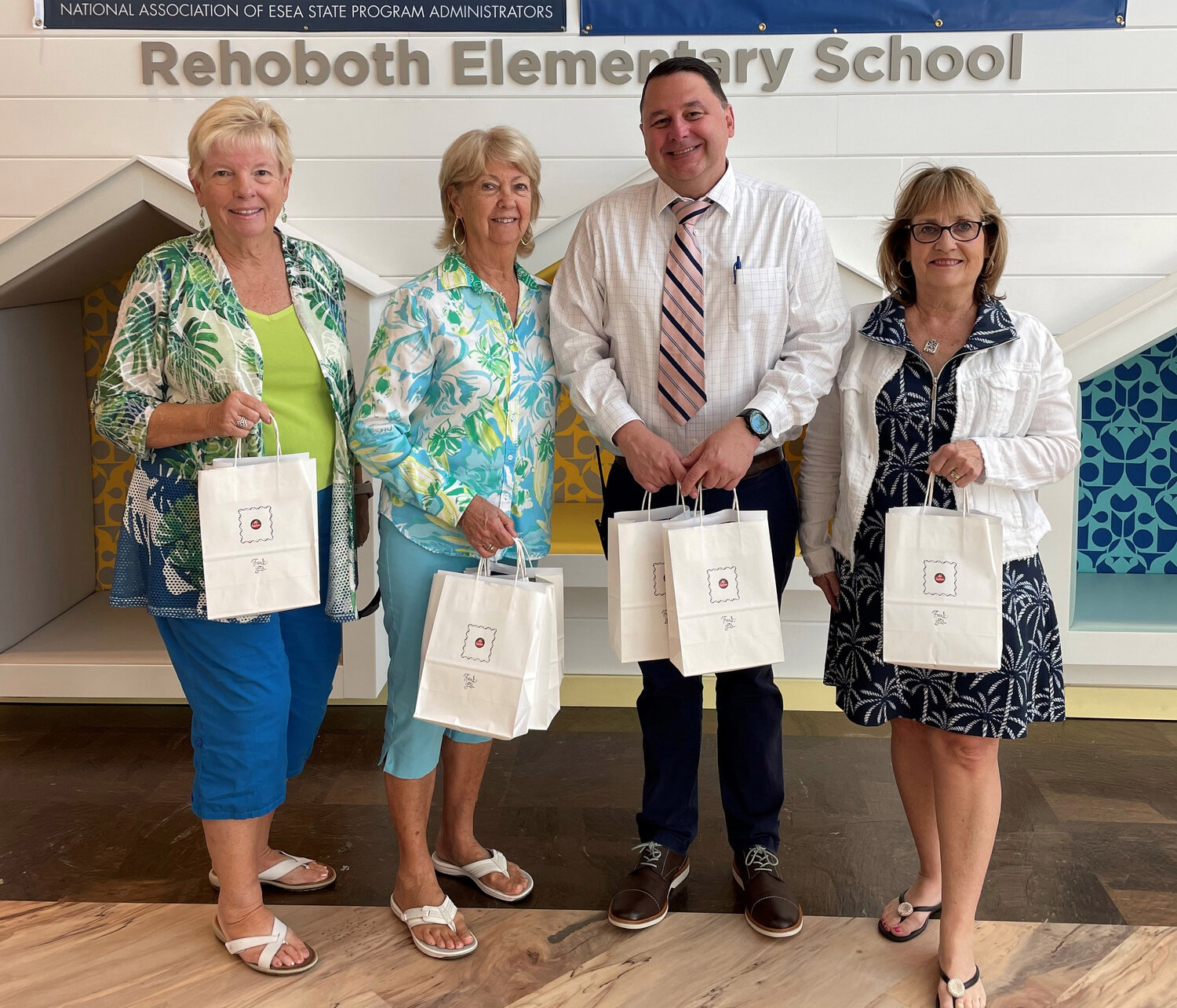 Rehoboth Beach Village Improvement Association delivered donations to Rehoboth Elementary School. From left, Diane Baerveldt, Lin Waggoner, Assistant Principal Kevin Monaghan and Kathy Jacobs.