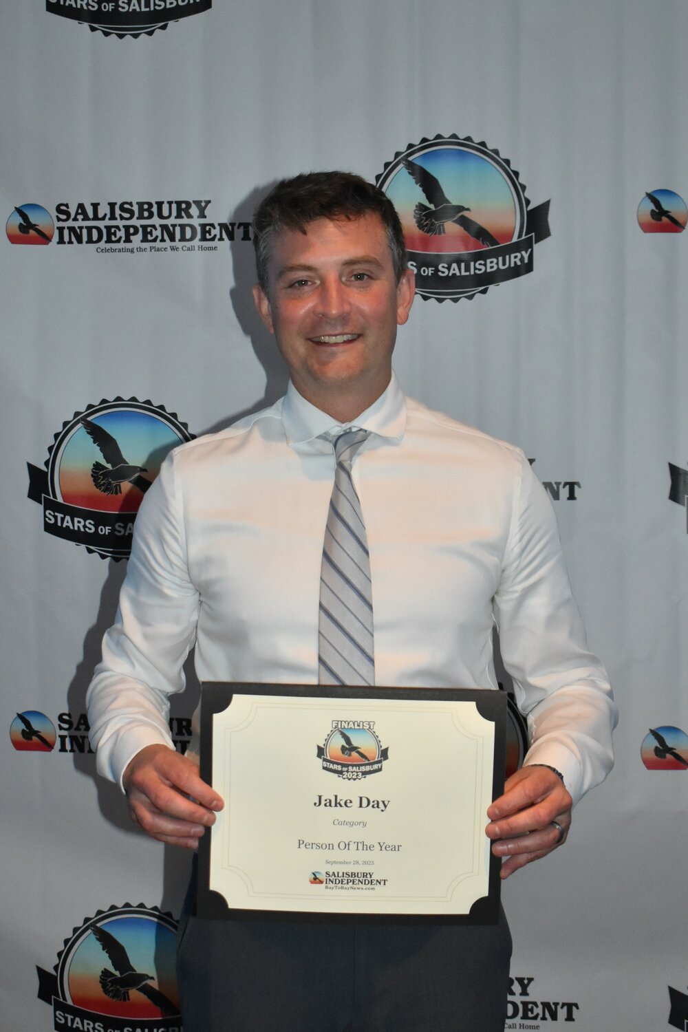 City administrator Andy Kitzrow collects the certificate on behalf of Person of the Year finalist Jacob “Jake” Day at Stars of Salisbury 2023.