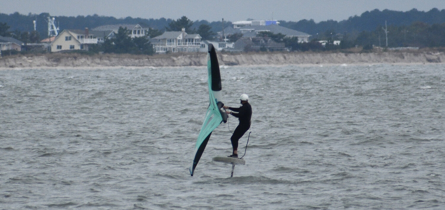 Robert Lavis on his hydrofoil board near Cape Henlopen State Park Fishing Pier. He said he had a blast on the waves out by The Point. My man has mad skills.
