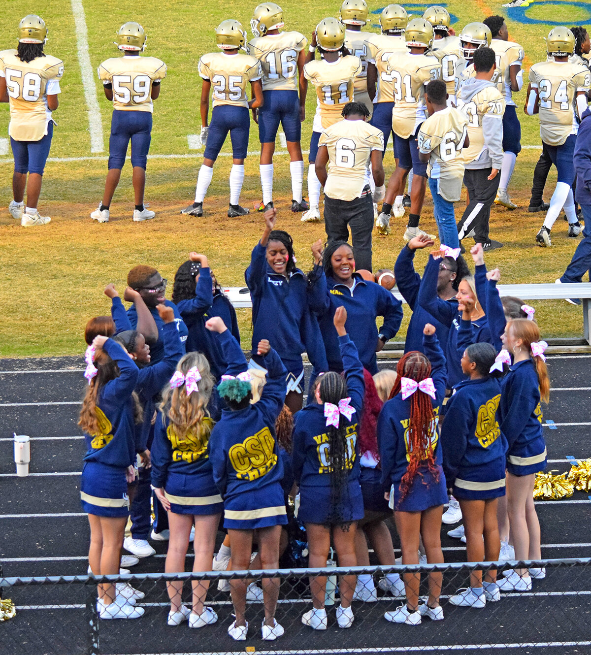 The Vikings varsity cheerleaders got themselves pumped up for the game.