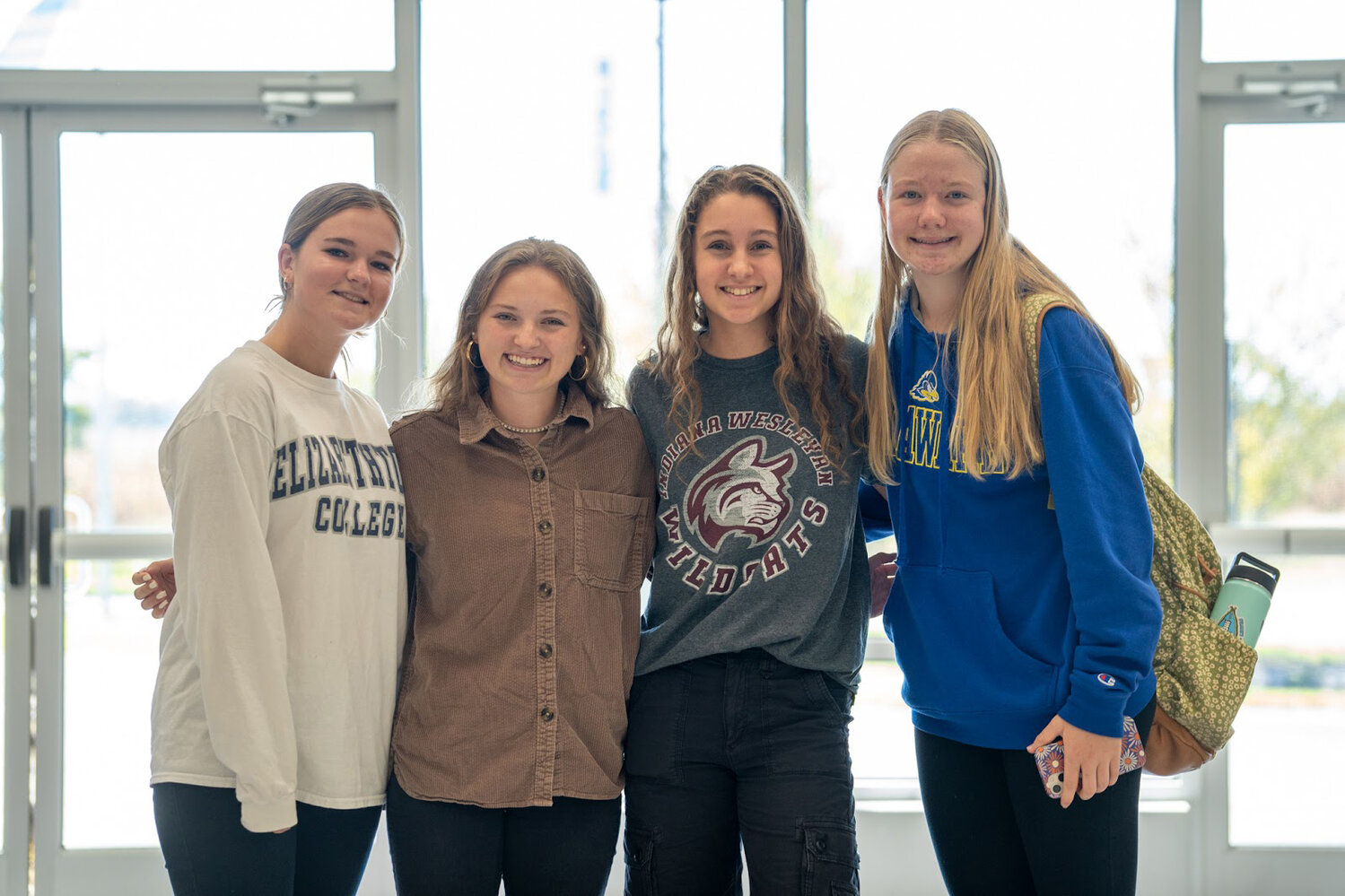 Libby Dawson, Megan Yoder, Layni Dukes, and Emily Obertubbesing spent their extended lunch period chatting with college representatives during College Week at Delmarva Christian High School.