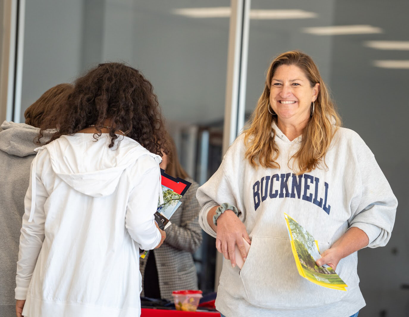 Delmarva Christian High School Counselor Terri Smith welcomes students to the Arts and Athletic Center of Delmarva Christian High School during College Week.