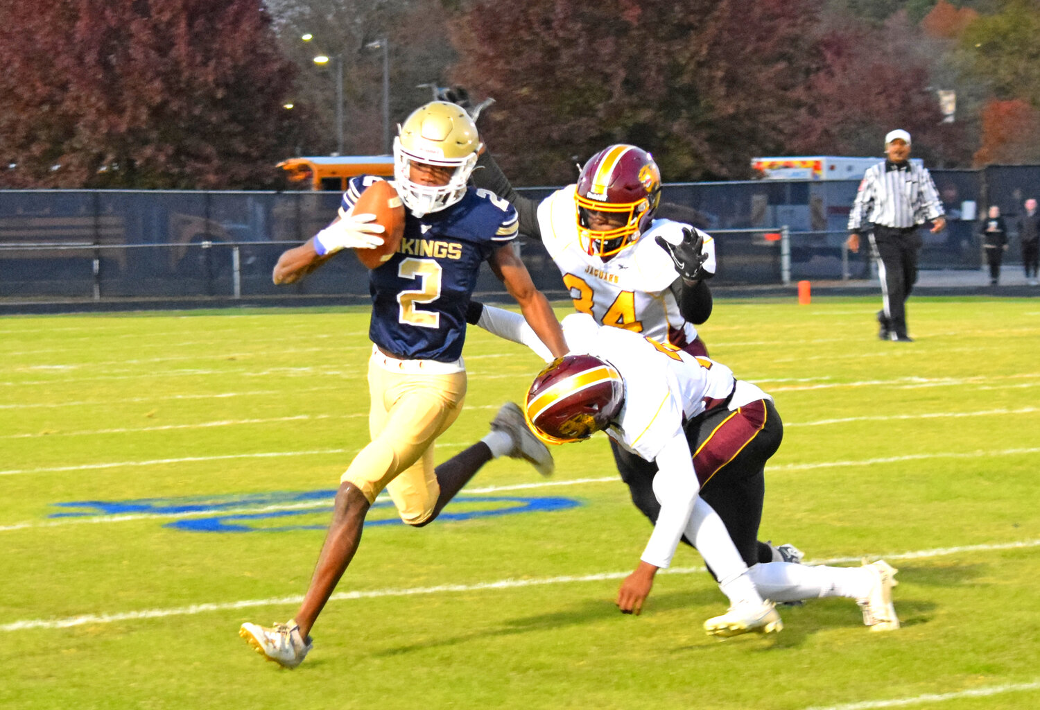 C-SD's Darren Belizaire stiff-armed a tackler as he carried the ball for a gain early in the victory over visiting Washington High School on Thursday.