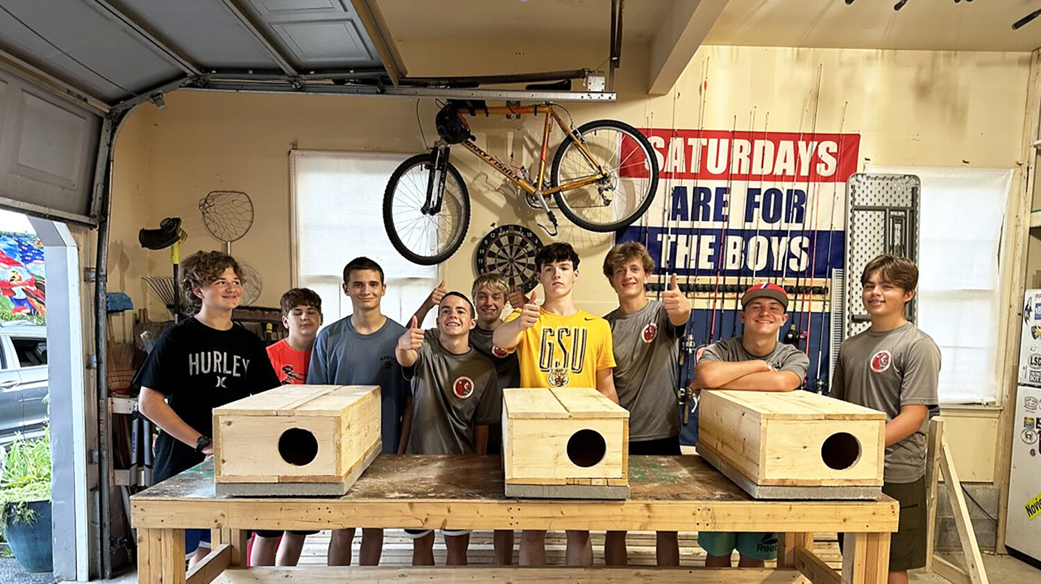 The Scouts with their catfish boxes include, from left, .Ethan Rich, Miles Rich, Ben Carter, Jacob Collins, Nathan Brothers, Jack Thornton, Chase Armour, Achilles Van Aulen and Gabriel Cruz.